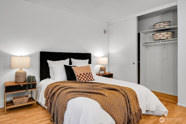 919 2nd Ave W Unit 103, Seattle, WA 98119 - bedroom with a closet and wood finished floors