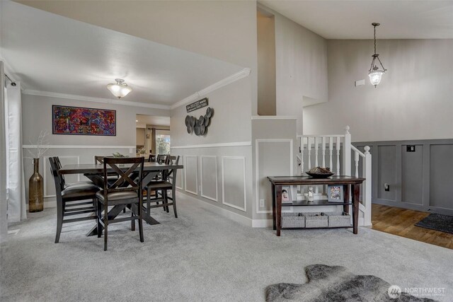 22506 SE 277th Pl, Maple Valley, WA 98038 - dining room featuring a decorative wall, ornamental molding, carpet, and a wainscoted wall