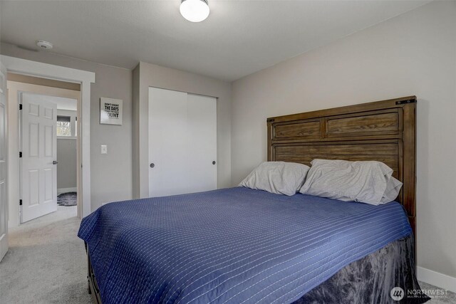 22506 SE 277th Pl, Maple Valley, WA 98038 - bedroom with carpet flooring, baseboards, and a closet