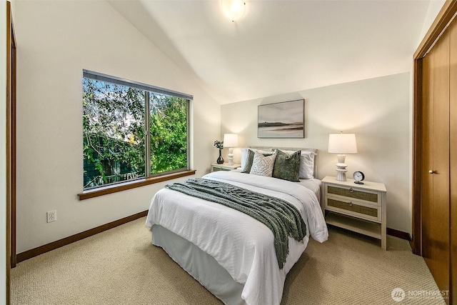 2648 NW 57th St Unit A, Seattle, WA 98107 - bedroom with lofted ceiling, carpet flooring, and baseboards