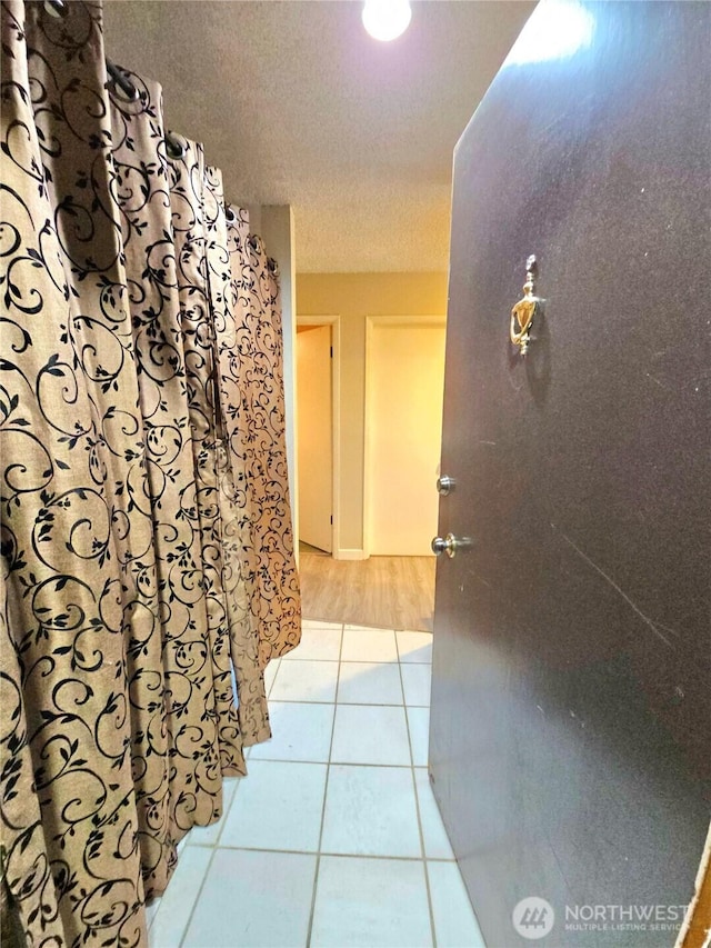 7924 212th St SW Unit 104, Edmonds, WA 98026 - hallway featuring light tile patterned floors