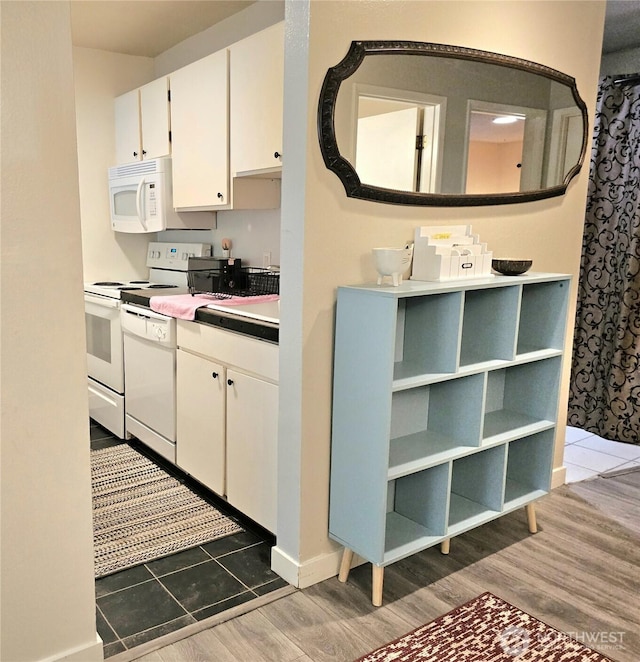 7924 212th St SW Unit 104, Edmonds, WA 98026 - kitchen featuring white appliances, wood finished floors, white cabinets, and light countertops