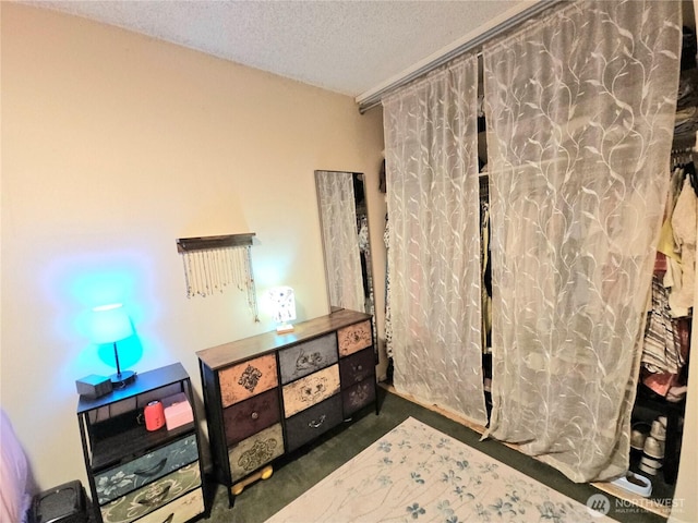 7924 212th St SW Unit 104, Edmonds, WA 98026 - carpeted bedroom featuring a textured ceiling