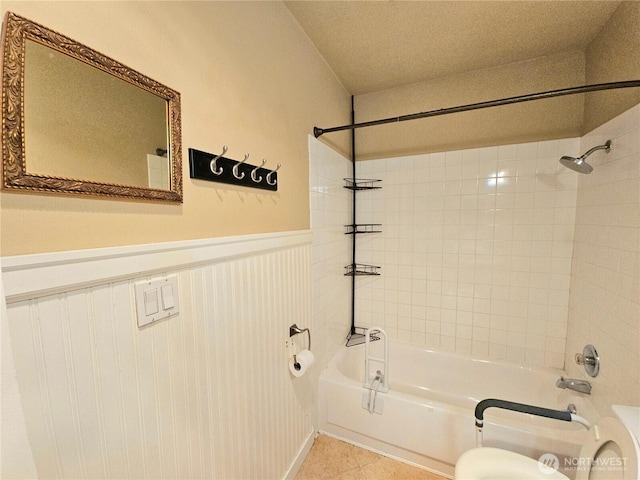 7924 212th St SW Unit 104, Edmonds, WA 98026 - full bath featuring bathtub / shower combination, wainscoting, and tile patterned floors