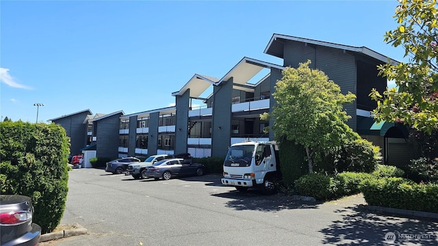 7924 212th St SW Unit 104, Edmonds, WA 98026 - view of building exterior featuring uncovered parking