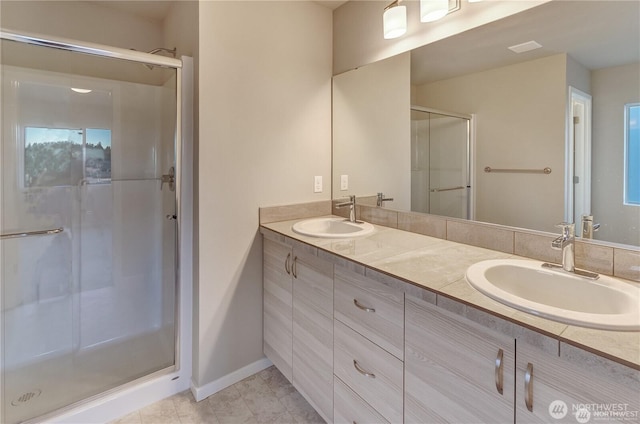 18226 37th Ave E, Tacoma, WA 98446 - bathroom featuring a shower stall, double vanity, and baseboards