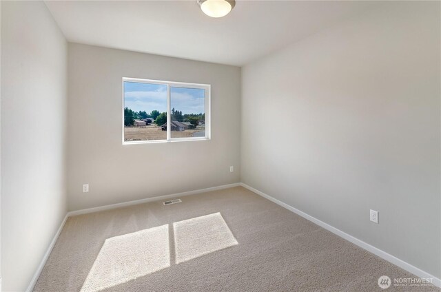 18226 37th Ave E, Tacoma, WA 98446 - spare room with carpet flooring and baseboards