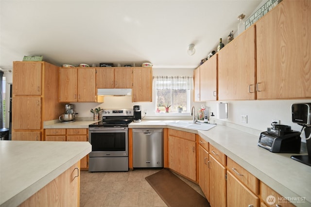 14617 Diamond Ave, Entiat, WA 98822 - kitchen with appliances with stainless steel finishes, a sink, under cabinet range hood, light countertops, and light brown cabinets
