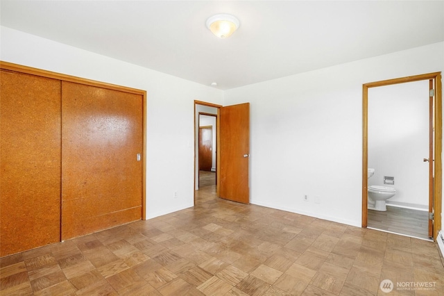 9023 Mcconnell Dr Unit B, Moses Lake, WA 98837 - unfurnished bedroom featuring a closet, ensuite bath, and baseboards