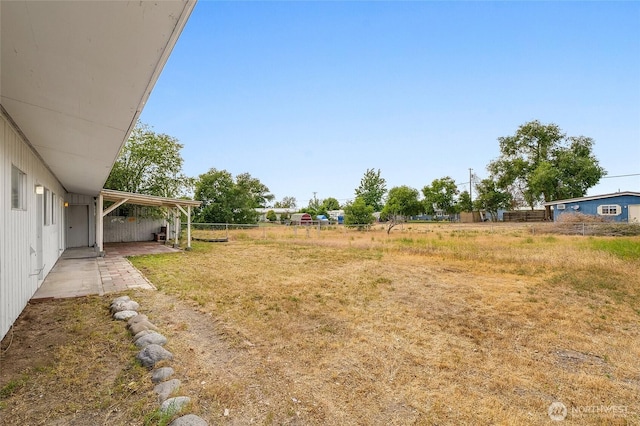 9023 Mcconnell Dr Unit B, Moses Lake, WA 98837 - view of yard with a patio and a carport