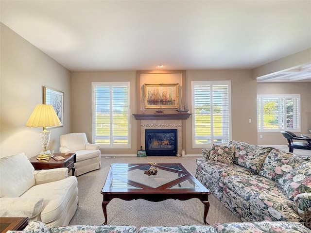 40 Cascadia Loop, Sequim, WA 98382 - living room with plenty of natural light, carpet flooring, and a fireplace with flush hearth