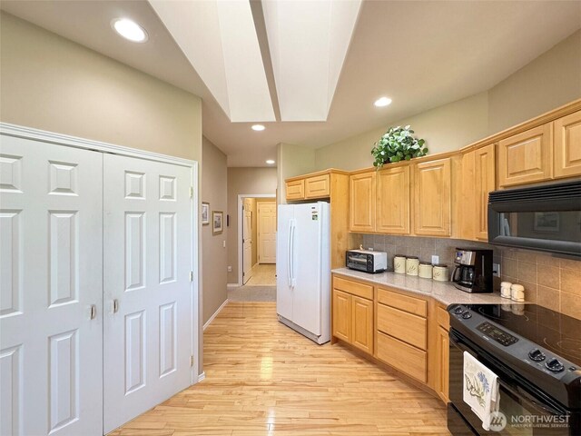 40 Cascadia Loop, Sequim, WA 98382 - kitchen featuring black appliances, backsplash, light wood-type flooring, light brown cabinetry, and recessed lighting