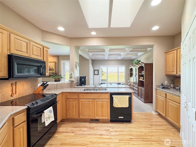 40 Cascadia Loop, Sequim, WA 98382 - kitchen with black appliances, a sink, light wood finished floors, a peninsula, and recessed lighting