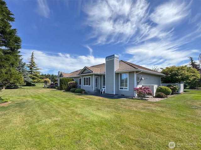 40 Cascadia Loop, Sequim, WA 98382 - rear view of house featuring a chimney and a lawn