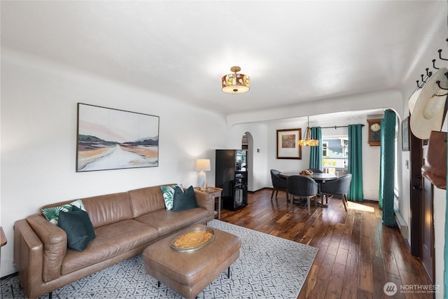 4908 N Winnifred, Ruston, WA 98407 - living room featuring arched walkways and dark wood-style flooring