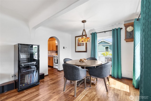 4908 N Winnifred, Ruston, WA 98407 - dining space with arched walkways and light wood-type flooring