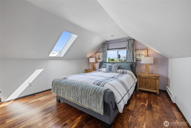 4908 N Winnifred, Ruston, WA 98407 - bedroom featuring a skylight, a baseboard heating unit, lofted ceiling, wood finished floors, and baseboards