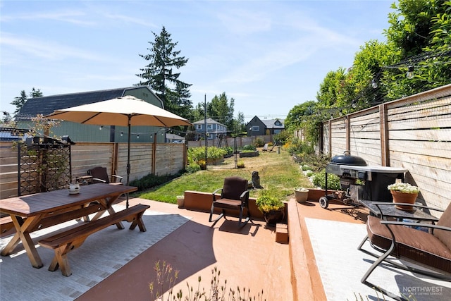 4908 N Winnifred, Ruston, WA 98407 - wooden terrace with outdoor dining area and a patio