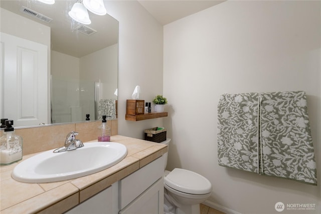 7615 14th St SE, Lake Stevens, WA 98258 - bathroom featuring vanity, toilet, and a shower