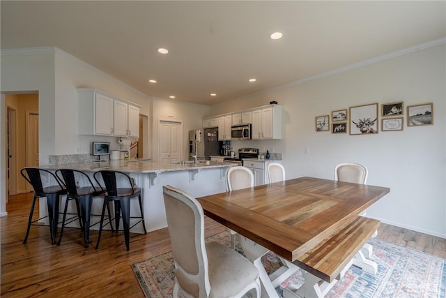 7615 14th St SE, Lake Stevens, WA 98258 - dining space featuring ornamental molding, wood finished floors, and recessed lighting