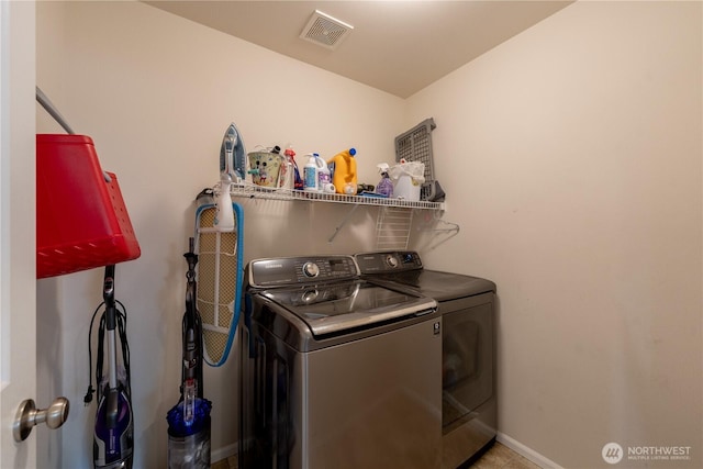 7615 14th St SE, Lake Stevens, WA 98258 - laundry area featuring washing machine and dryer and baseboards