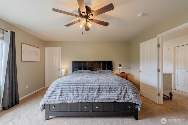 7615 14th St SE, Lake Stevens, WA 98258 - bedroom featuring light colored carpet, ceiling fan, and baseboards