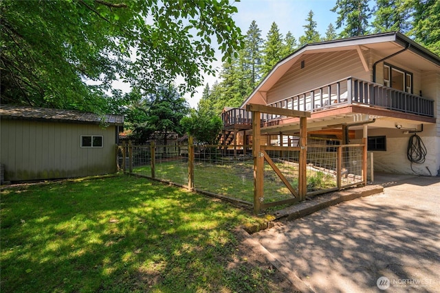 3536 Arbor St, Bellingham, WA 98229 - view of yard with an outdoor structure, a gate, driveway, and a wooden deck