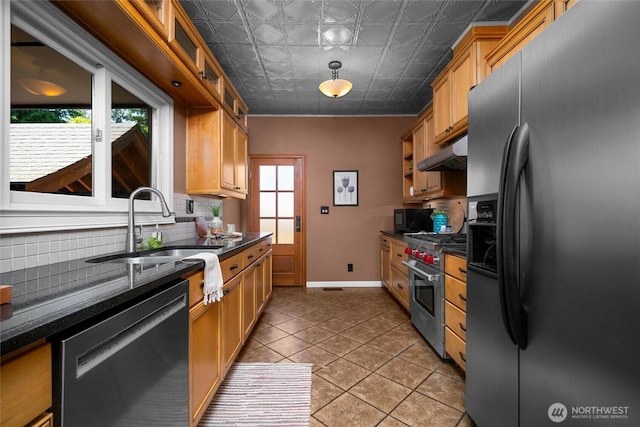 3536 Arbor St, Bellingham, WA 98229 - kitchen featuring appliances with stainless steel finishes, decorative backsplash, under cabinet range hood, a sink, and light tile patterned floors