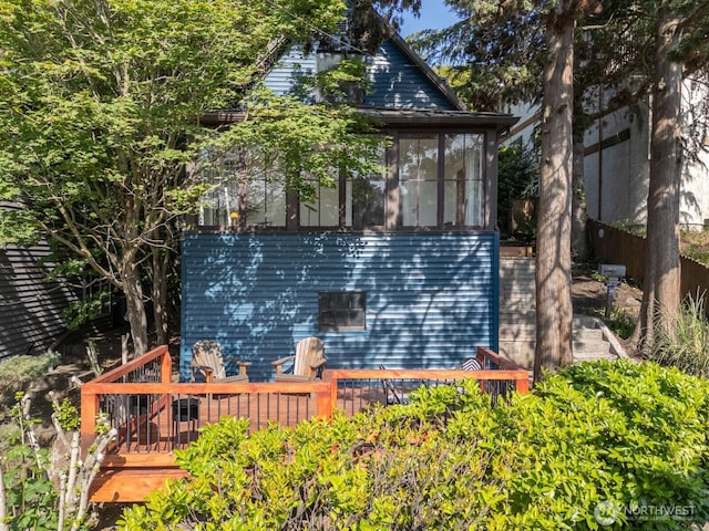 2560 Gilman Dr W, Seattle, WA 98119 - view of property exterior with a sunroom and a deck