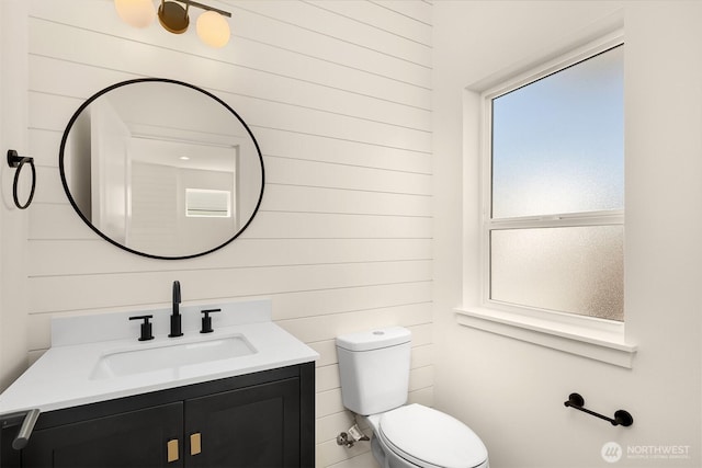 118 4th Ave S, Algona, WA 98001 - bathroom with toilet, vanity, and wood walls