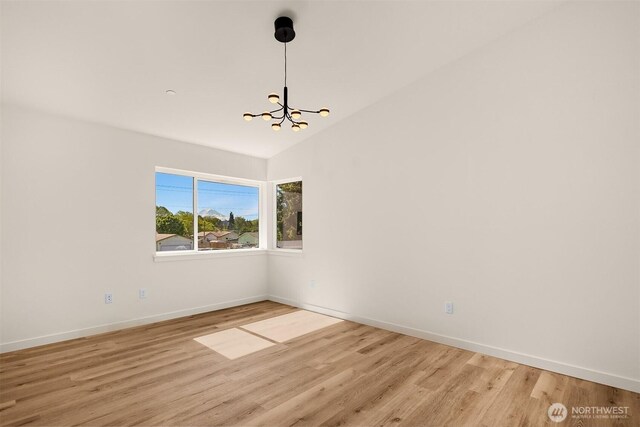 118 4th Ave S, Algona, WA 98001 - spare room with a chandelier, light wood-type flooring, baseboards, and lofted ceiling