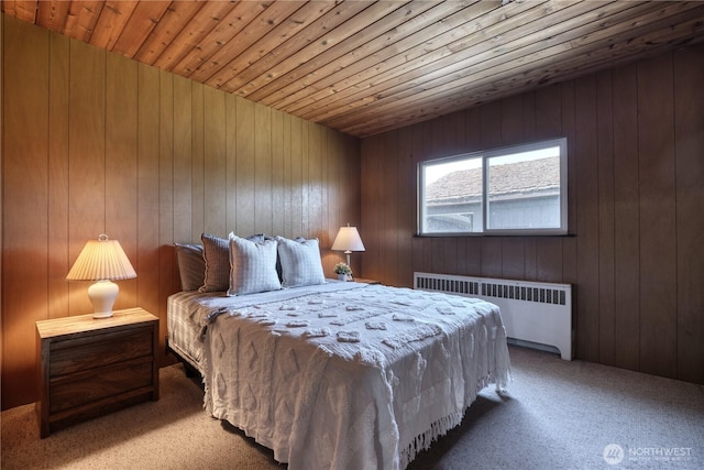 1811 Edwards Dr, Point Roberts, WA 98281 - carpeted bedroom featuring radiator heating unit, wood ceiling, and wood walls