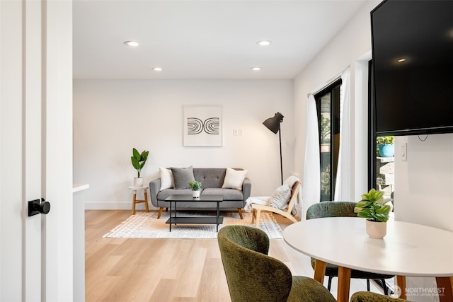 3240 32nd Ave W Unit B, Seattle, WA 98199 - living area featuring light wood finished floors, recessed lighting, and baseboards