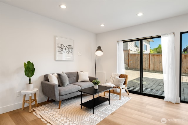 3240 32nd Ave W Unit B, Seattle, WA 98199 - living room featuring light wood-style flooring, recessed lighting, and baseboards