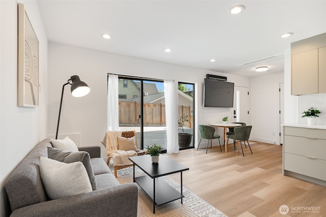 3240 32nd Ave W Unit B, Seattle, WA 98199 - living room featuring light wood-style floors and recessed lighting