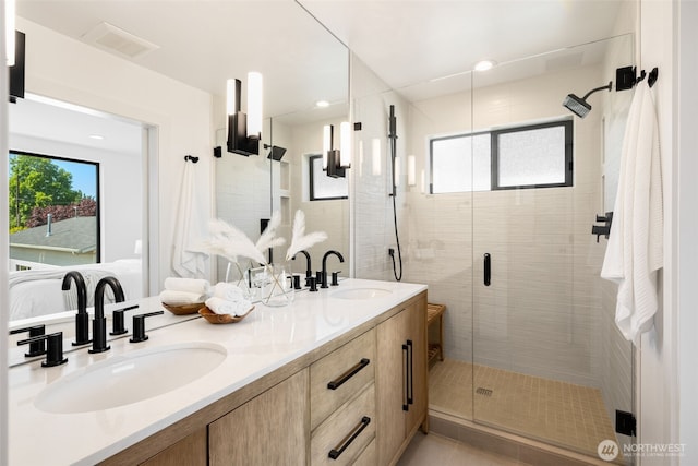 3240 32nd Ave W Unit B, Seattle, WA 98199 - full bathroom featuring a shower stall and double vanity