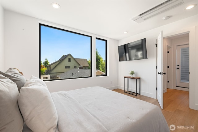 3240 32nd Ave W Unit B, Seattle, WA 98199 - bedroom with light wood-type flooring, recessed lighting, and baseboards