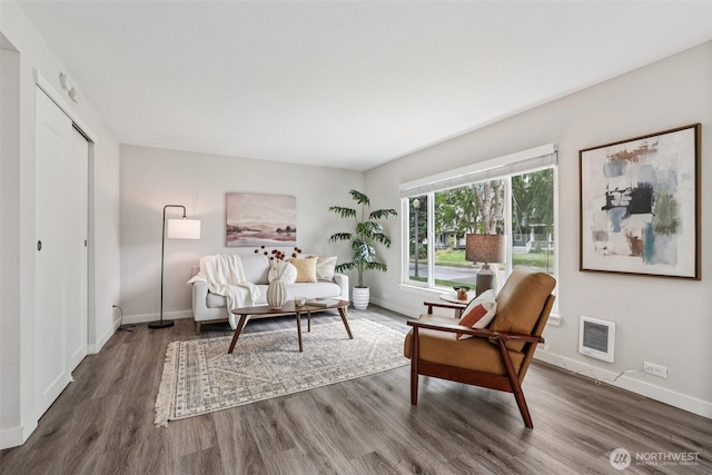 1022 N Anderson St, Tacoma, WA 98406 - living room featuring wood finished floors and heating unit
