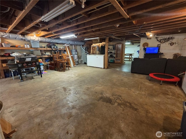 418 SW Canyon Loop, Winlock, WA 98596 - unfinished below grade area with fridge and gas water heater