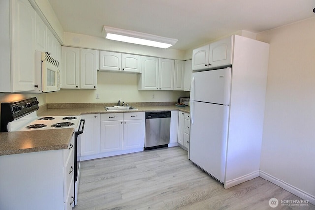 220 SW Clark St Unit B303, Issaquah, WA 98027 - kitchen featuring white appliances, light wood-style flooring, white cabinets, a sink, and baseboards
