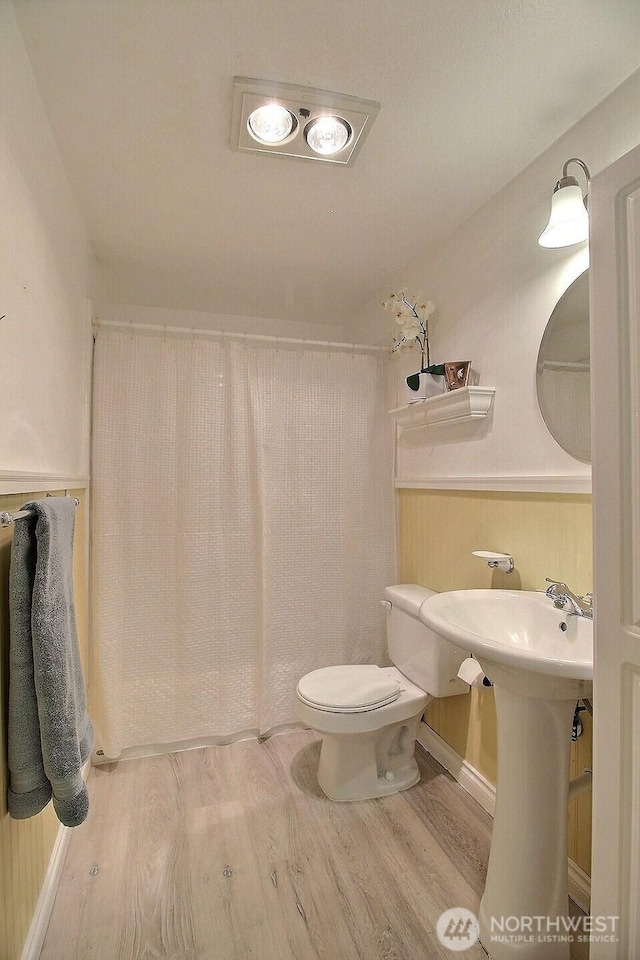 220 SW Clark St Unit B303, Issaquah, WA 98027 - bathroom featuring wood finished floors, toilet, and curtained shower