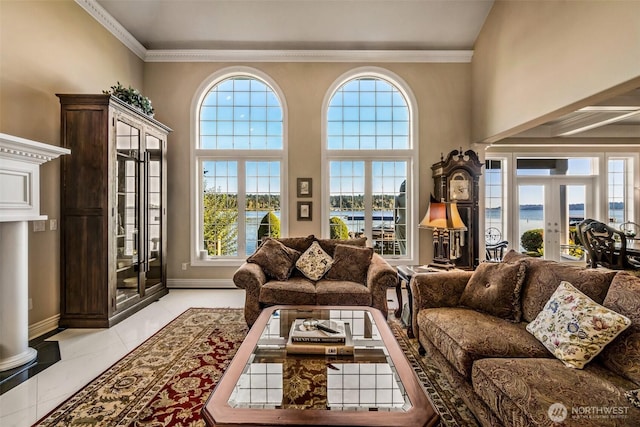 17765 Beach Dr NE, Lake Forest Park, WA 98155 - living room with french doors, a water view, ornamental molding, and baseboards