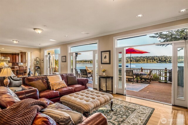 17765 Beach Dr NE, Lake Forest Park, WA 98155 - living room with crown molding, a water view, light wood finished floors, and recessed lighting
