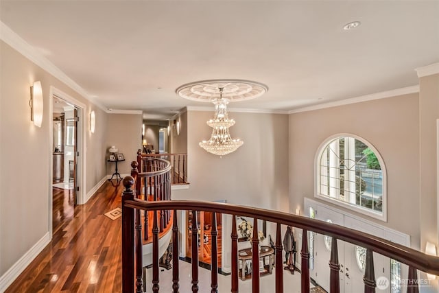 17765 Beach Dr NE, Lake Forest Park, WA 98155 - hallway featuring an upstairs landing, wood finished floors, a chandelier, baseboards, and ornamental molding