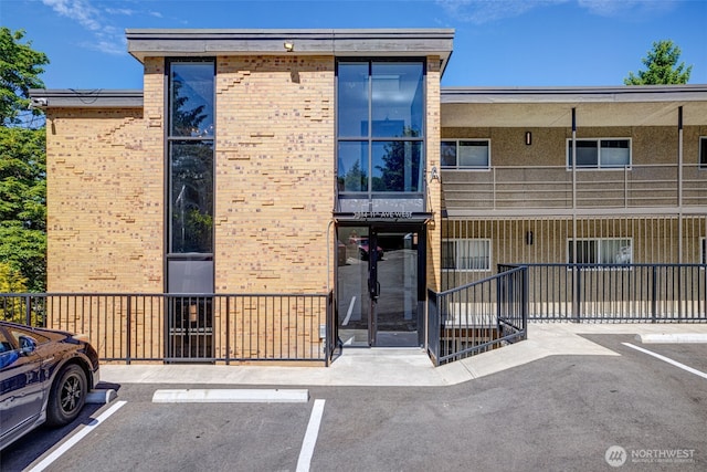 3814 11th Ave W Apt 23, Seattle, WA 98119 - view of building exterior featuring uncovered parking
