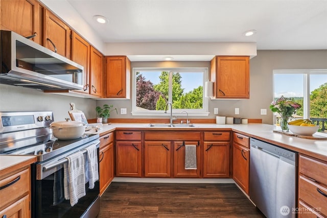 26820 NE 163rd St, Duvall, WA 98019 - kitchen featuring stainless steel appliances, light countertops, plenty of natural light, brown cabinets, and recessed lighting