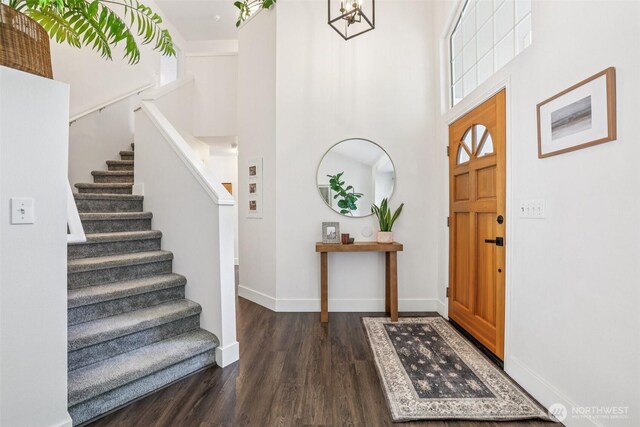 26820 NE 163rd St, Duvall, WA 98019 - entrance foyer featuring wood finished floors, stairway, baseboards, a towering ceiling, and a chandelier