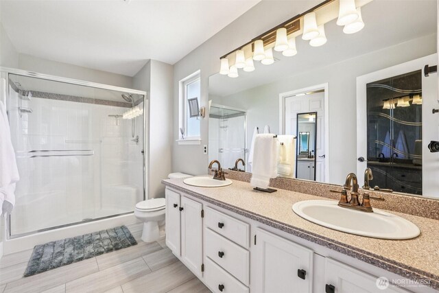 26820 NE 163rd St, Duvall, WA 98019 - full bathroom featuring double vanity, a stall shower, and toilet