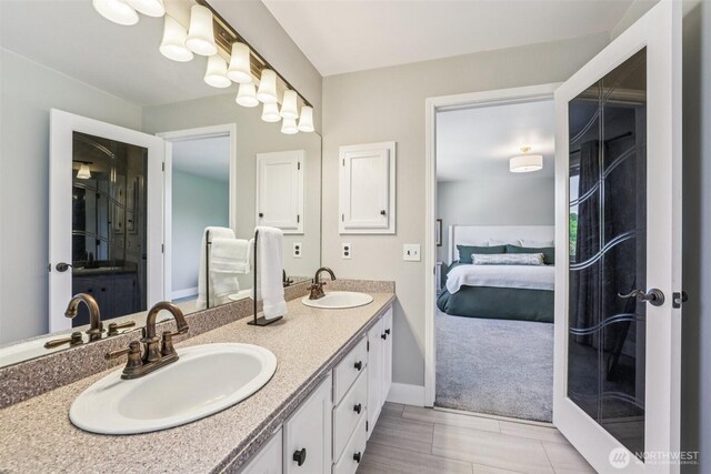 26820 NE 163rd St, Duvall, WA 98019 - bathroom with ensuite bath, double vanity, and baseboards