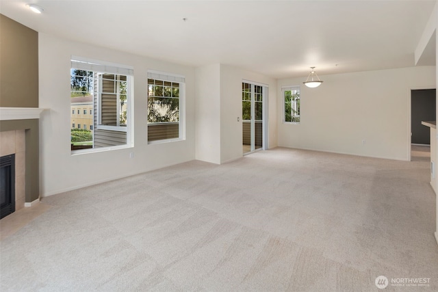 2220 132nd Ave SE Unit A220, Bellevue, WA 98005 - unfurnished living room with a fireplace and light carpet